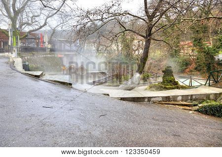 LOUTRA POZAR ARIADAEUS GREECE - March 15, 2016: River Termopotamos. Embankment of the river next to the thermal spring.