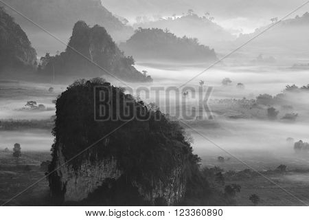 Misty morning light on the top of the mountain hills. Phu Langka  panorama view.
