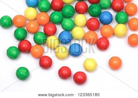 colored bubble gum balls isolated on white, top view