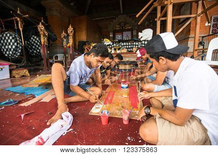 UBUD, INDONESIA - MAR 5, 2016: Unidentified local people during built Ogoh-ogoh are statues for the Ngrupuk parade, which takes place on the eve of Nyepi day. Nyepi is a public holiday in Indonesia.