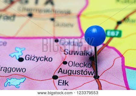 Photo of pinned Augustow on a map of Poland. May be used as illustration for traveling theme.