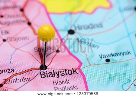 Photo of pinned Bialystok on a map of Poland. May be used as illustration for traveling theme.