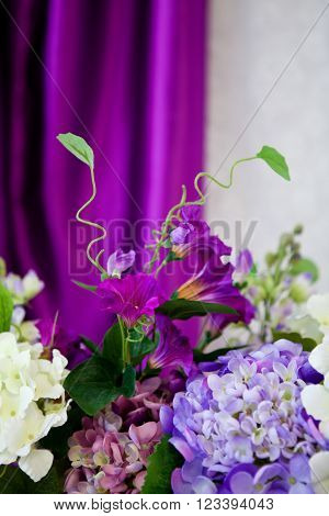 Bouquet of beautiful flowers lilac in a room in the interior