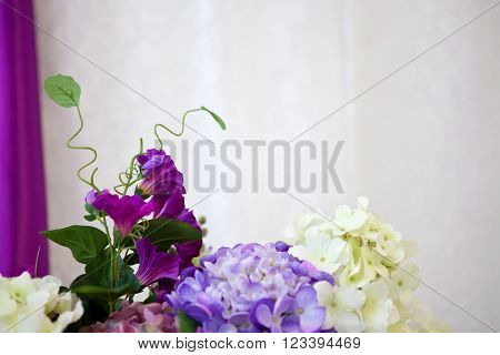 Bouquet of beautiful flowers lilac in a room in the interior