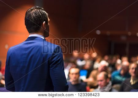 Speaker giving a talk on corporate Business Conference. Audience at the conference hall. Business and Entrepreneurship event.
** Note: Soft Focus at 100%, best at smaller sizes