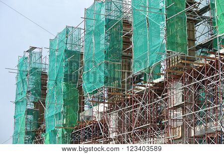 SELANGOR, MALAYSIA -FEBRUARY 11, 2015: Scaffolding used to support a platform or form work as the temporary structure at the construction site for construction workers to work.