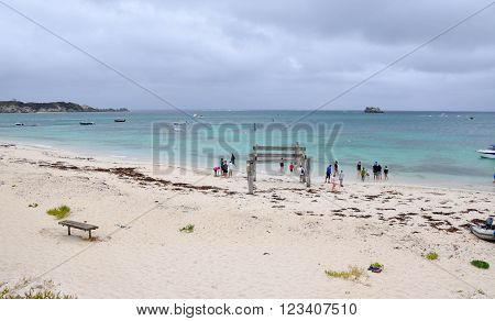 HAMELIN BAY,WA,AUSTRALIA-JANUARY 17,2016: People and Jetty ruins on the turquoise Indian Ocean coast line under stormy skies in Hamelin Bay, Western Australia.