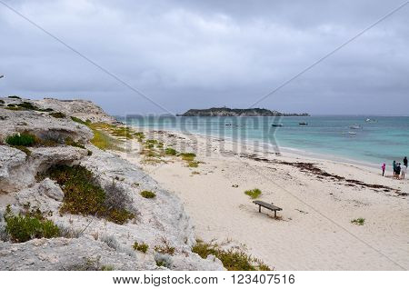 HAMELIN BAY,WA,AUSTRALIA-JANUARY 17,2016: People  on beach with views of Hamelin Island and  turquoise Indian Ocean waters on a stormy day in Hamelin Bay, Western Australia.