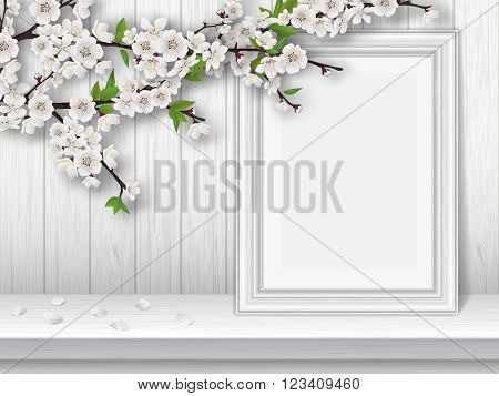 Spring blooming cherry branch and photo frame on a white table. Spring vintage interior decor. Vector greeting card template.