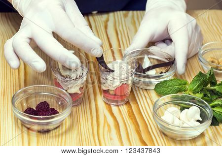 cook prepares canapes in the kitchen at the restaurant
** Note: Shallow depth of field