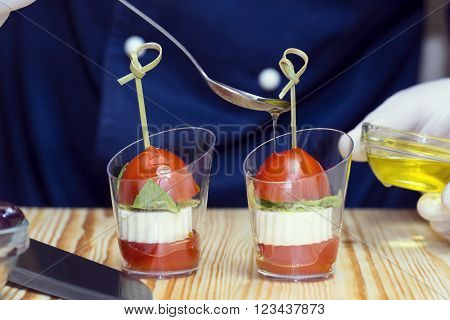 cook prepares canapes in the kitchen at the restaurant
** Note: Shallow depth of field