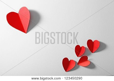 Red paper heart isolated on white background with copy space
