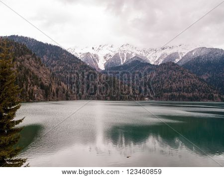 Beautiful lake Ritsa high among the snow-capped mountains Abkhazia