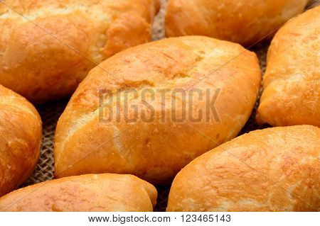 Traditional  russian pastry -  piroshki as background.