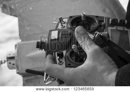 Remote Control For Quadrocopter Unmanned Aerial Vehicle In Snow In Their Hands.