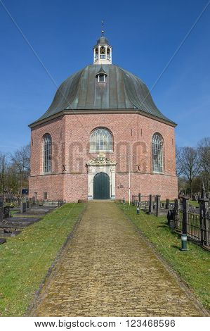 SAPPEMEER, NETHERLANDS - MARCH 26, 2016: Path leading to the Koepelkerk in Sappemeer, Netherlands