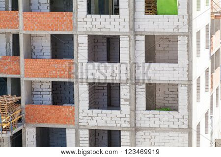 Monolithic frame construction of the building. Solid walls of concrete. Formwork for walls made of concrete. Construction of the building. Masonry walls and aerated concrete masonry walls