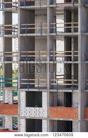 Monolithic frame construction of the building. Solid walls of concrete. Formwork for walls made of concrete. Construction of the building. Masonry walls and aerated concrete masonry walls