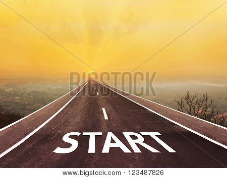 Text start on long paveway road aboved blurred top city view along to golden sun rise for abstract background with copy space
