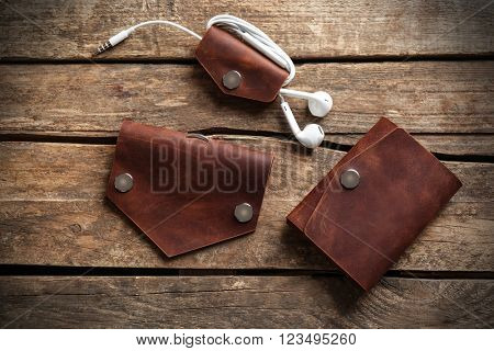 Hand made leather man accessories on wooden background