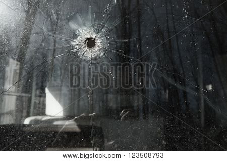 Bullet Hole in old school bus  Window
