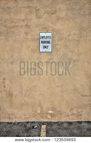 Employee Parking Sign in Empty Parking Spot