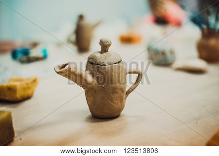 unfired clay jug handmade is on the table