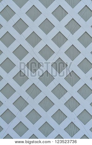 white lattice pattern on pale green background