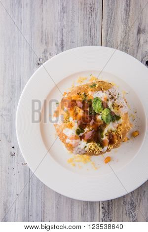 Rajasthani Shahi Raj Kachori, stuffed katchori with potato and sprout filling and served with curd, chutney and sev
