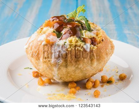 Rajasthani Shahi Raj Kachori, stuffed katchori with potato and sprout filling and served with curd, chutney and sev