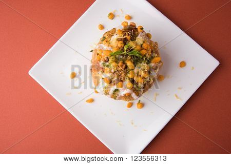 Rajasthani Shahi Raj Kachori, stuffed katchori with potato and sprout filling and served with curd, chutney and sev