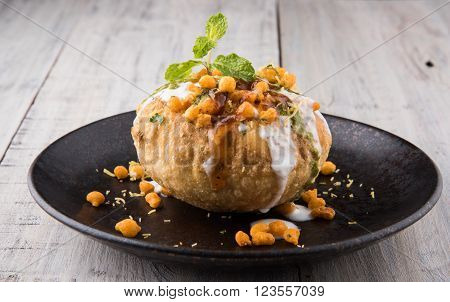 Rajasthani Shahi Raj Kachori, stuffed katchori with potato and sprout filling and served with curd, chutney and sev