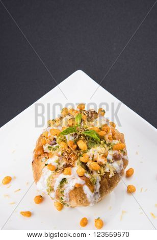 Rajasthani Shahi Raj Kachori, stuffed katchori with potato and sprout filling and served with curd, chutney and sev