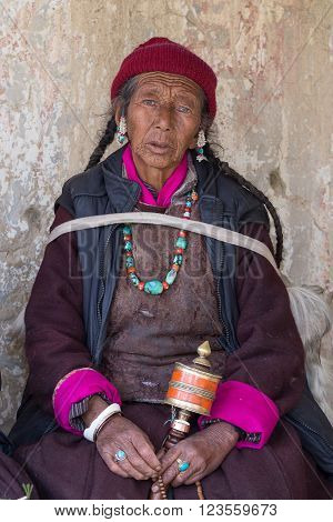 LAMAYURU INDIA - JUNE 15 2015: Unidentified buddhist old women during mystical mask dancing Tsam mystery dance in time of Yuru Kabgyat Buddhist festival at Lamayuru Gompa Ladakh North India
