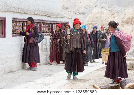 LAMAYURU INDIA - JUNE 15 2015: Unidentified buddhist old women during mystical mask dancing Tsam mystery dance in time of Yuru Kabgyat Buddhist festival at Lamayuru Gompa Ladakh North India