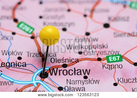 Photo of pinned Wroclaw on a map of Poland. May be used as illustration for traveling theme.