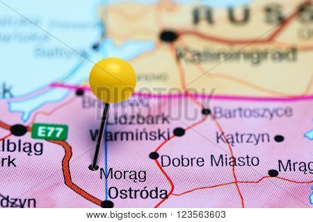 Photo of pinned Morag on a map of Poland. May be used as illustration for traveling theme.