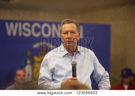 MADISON WI/USA - March 28 2016: Republican presidential candidate John Kasich speaks to a group of supporters during a town hall event before the Wisconsin presidential primary in Madison Wisconsin.