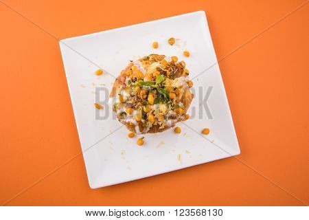 Rajasthani Shahi Raj Kachori, stuffed katchori with potato and sprout filling and served with curd, chutney and sev