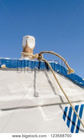 Detail of a wooden boat dock with mooring bitts