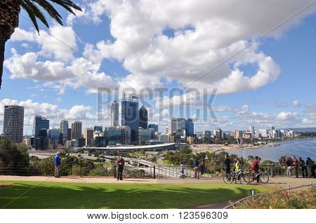 PERTH,WA,AUSTRALIA-AUGUST 22,2015: Elevated view from King's Park of the cityscape, roadways, Swan River and tourists in Perth, Western Australia.