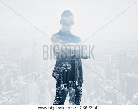 Photo of stylish adult businessman wearing trendy suit and looking city. Double exposure, panoramic view contemporary City background.