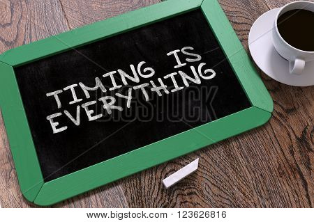 Hand Drawn Timing is Everything Concept  on Small Green Chalkboard. Business Background. Top View. 3D Render.