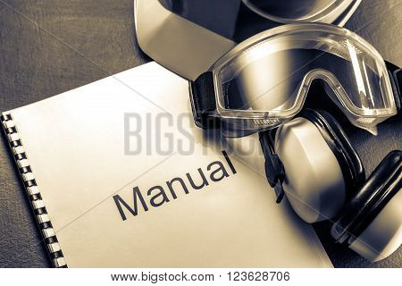 Manual with helmet goggles and headphones in toning