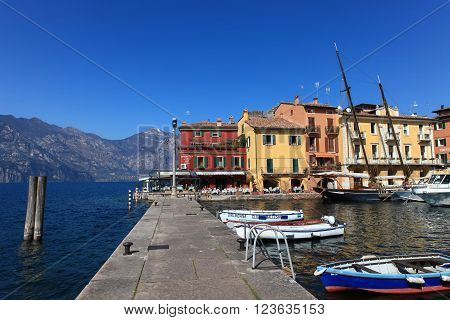 Malcesine, Italy - March 17, 2016: View of Malcesine town center and small port. Malcesine is located on the eastern shore of Lake Garda in the Province of Verona in the Italian region Veneto