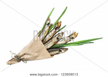 Smoked capelin with green onions in paper cornet on white background. Top view