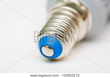 Macro of Led lamp pamp-cap on white, selective focus, shallow DOF