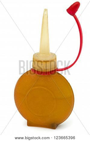Old bottle of lubricating machine oil isolated on white background