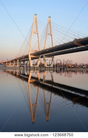 Cable stayed bridge and Neva river on the outskirts of St. Petersburg at sunny spring day Russia.