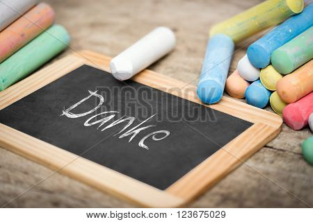 Slate with german word Danke which means thank you colorful chalk